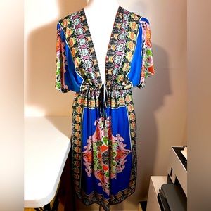 Summer dress or swimsuit, cover deep V lines. Med. Drawstring at bus line.